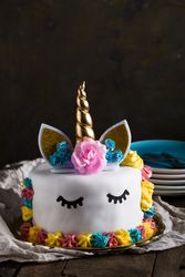 Cute unicorn cake with painted closed eyes