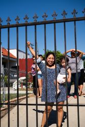 Los Angeles, CA, USA — June 7th, 2020: mother with fist in air holding a baby at rally