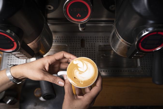 Barista using coffee machine