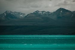 Sea coast with turquoise water and rocky mountains