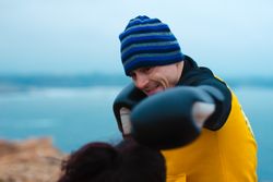 Boxers exercising on cliff