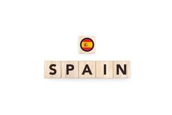 Wooden blocks bearing the name and flag of Spain.