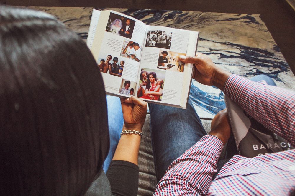 Man and woman reading a book together