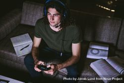 Video gamer concentrating on screen while playing game 5kPXW4