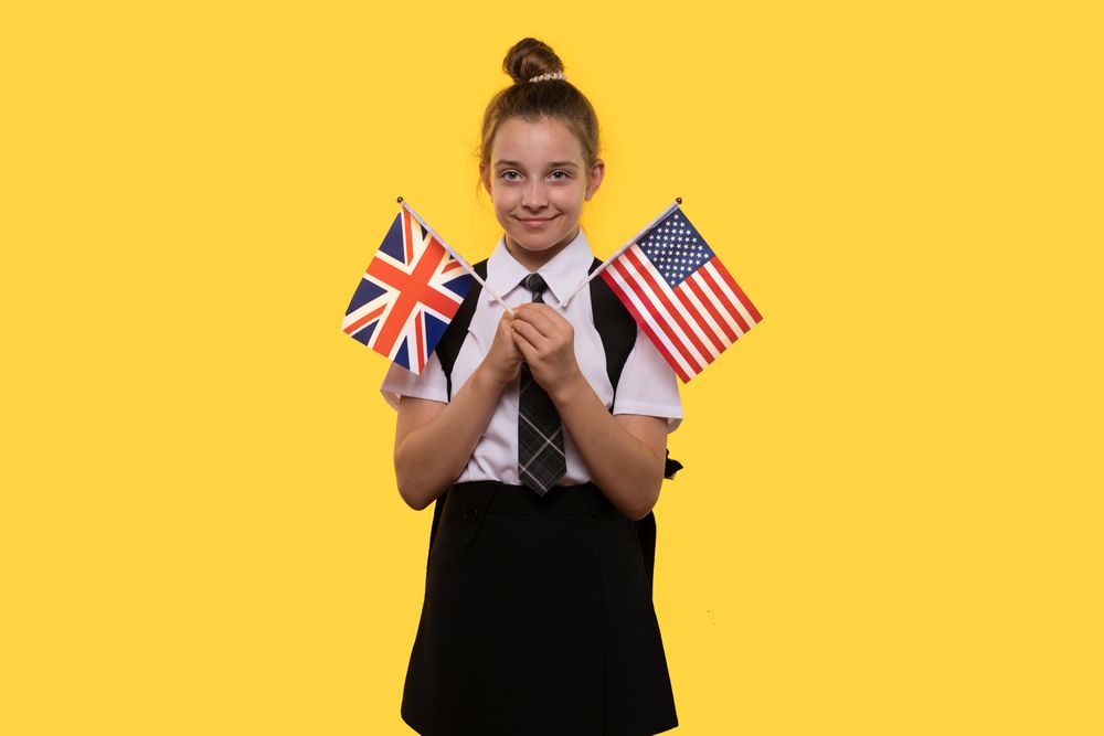 Schoolgirl holds both the British and American flags