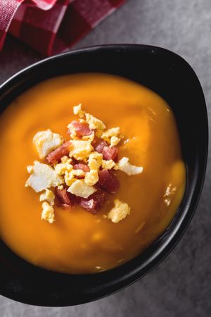 Bowl with salmorejo ham and hard boiled egg