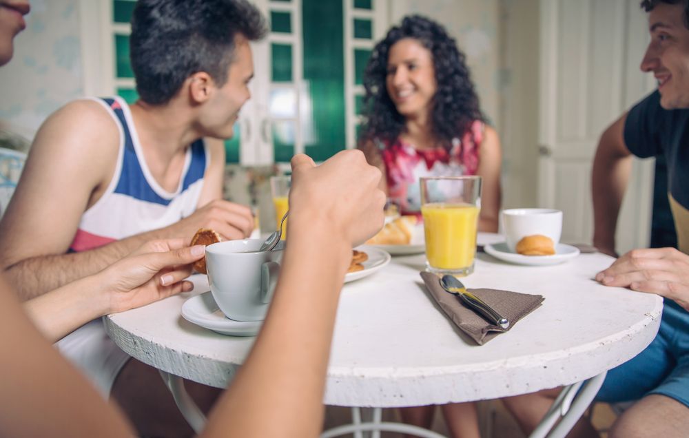 Friends enjoying continental breakfast together