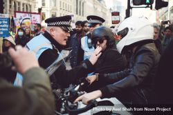 London, England, United Kingdom - March 19 2022: Police clash with 2 people in helmets 48OqZ5