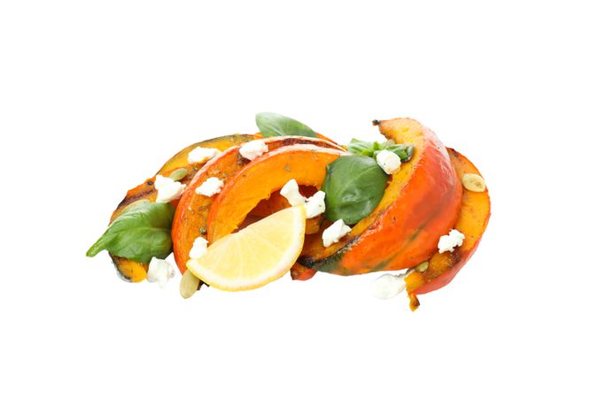 Baked pumpkin isolated on light background