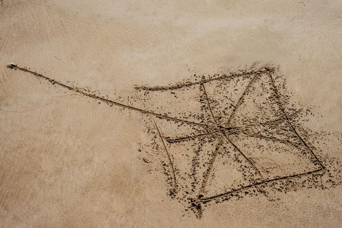 Drawing of kite in the sand