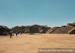 People walking among ancient Zapotec ruins in Mexico 5XyRM4