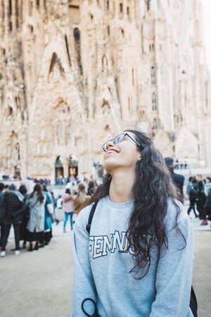 Smiling female tourist on city street