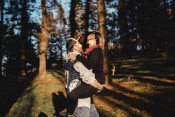 Happy young couple hugging in park