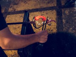 Crop craftsman making glass decanter