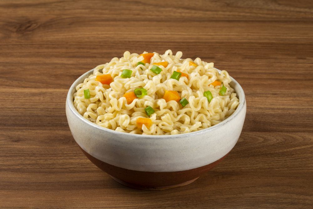Bowl with instant noodles on the table.