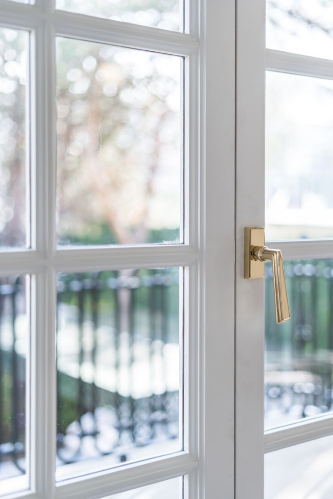 Minimalist balcony door with shiny knob