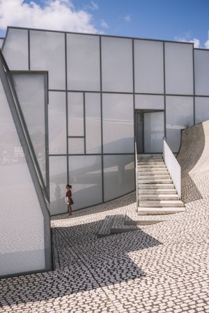 Woman next to contemporary building