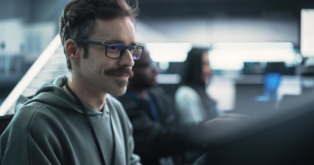 Portrait of a Happy Mustachioed Computer Science Team Member