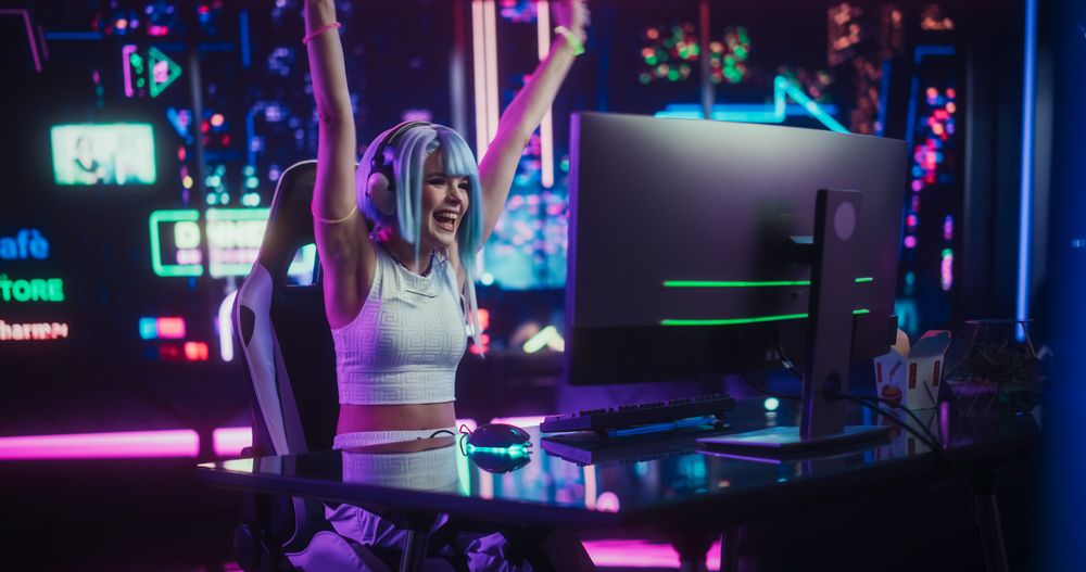 Online Gamer Playing a Video Game in a Futuristic Cyberpunk Room. Cosplayer with Blue Hair Using Headphones