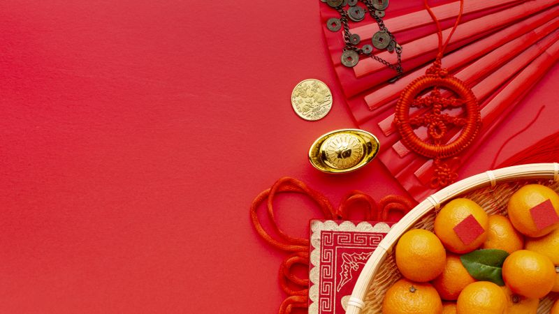 Basket of tangerines with Chinese pendants for new year