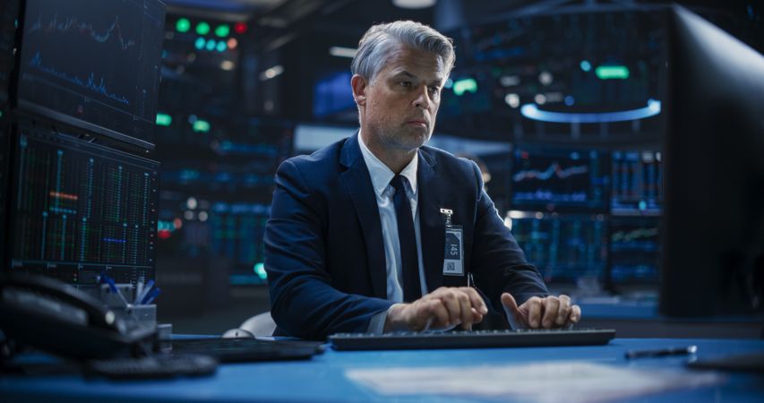 Portrait of an Adult Man Working in an International Stock Exchange Company