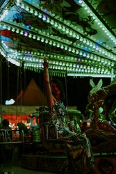 Woman enjoying ride on carousel