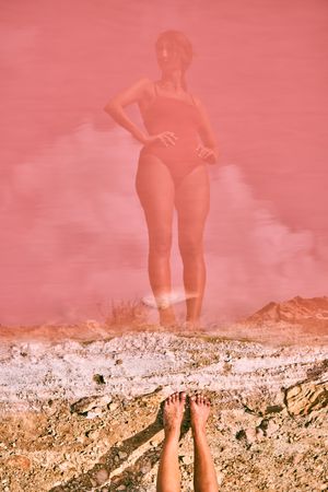 Fit woman in swimsuit posturing on pink lake shore