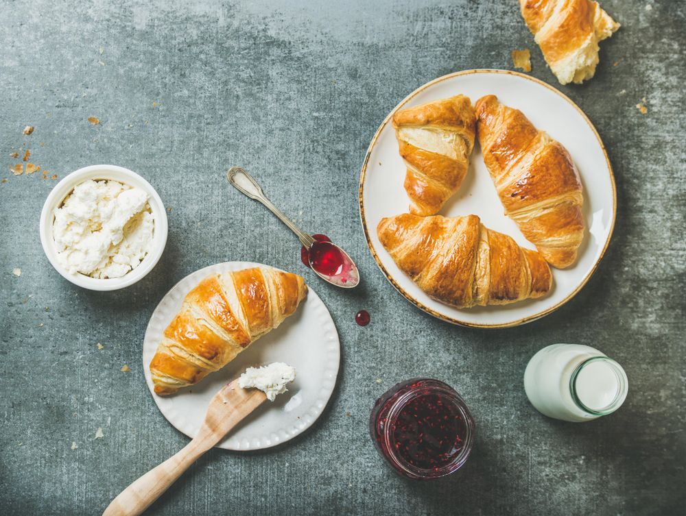 Top view of croissant with jam and cream cheese