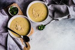 Traditional Georgian chicken soup on grey counter