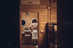 Man getting out of the shower and looking in the mirror