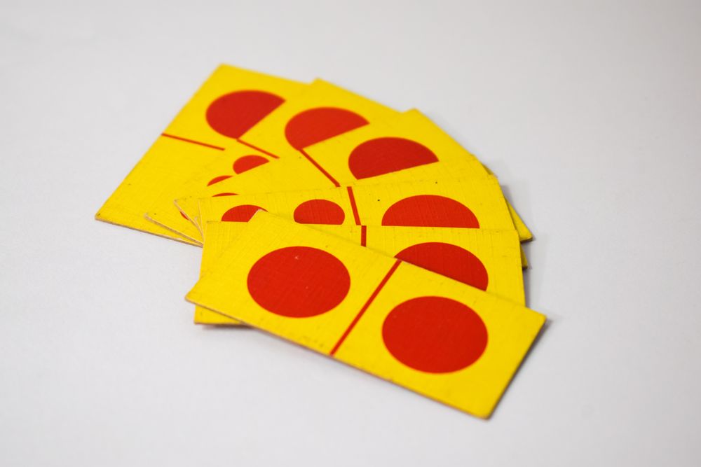 Domino cards spread out on table