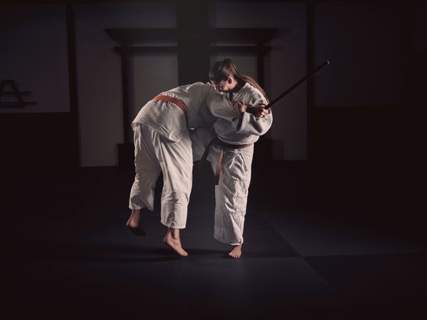 Man and woman fighting during Krav Maga lesson