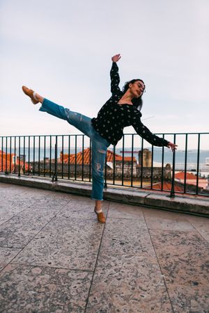 dancer jumping against cityscape
