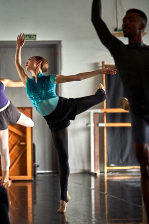 Ballet dancer warming up and dancing at a dance academy