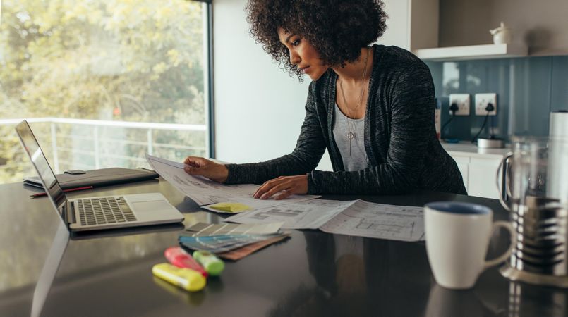 Female designer working at home office on new ideas