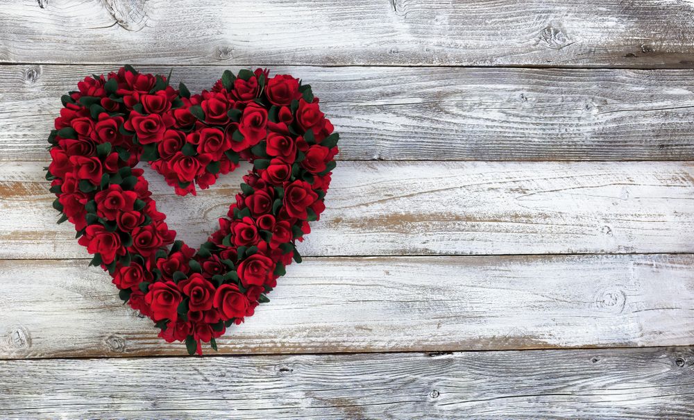 Valentine’s day wooden heart wreath on old wood