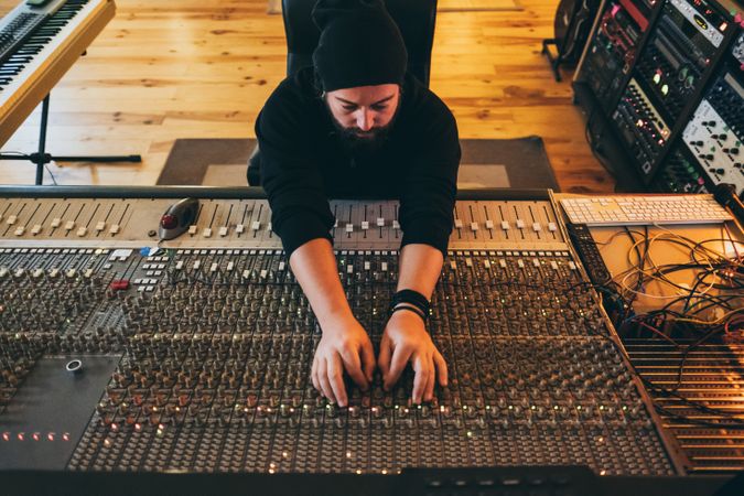 Man in a equalizer instrument in a studio