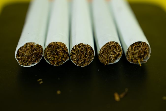 Top of five cigarettes with space for text