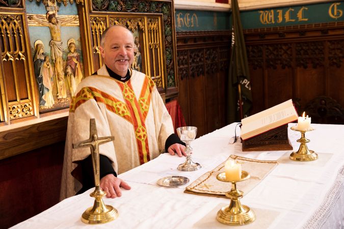 Vicar at altar