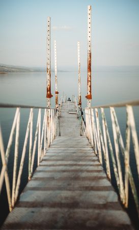 Rusty pier near calm sea