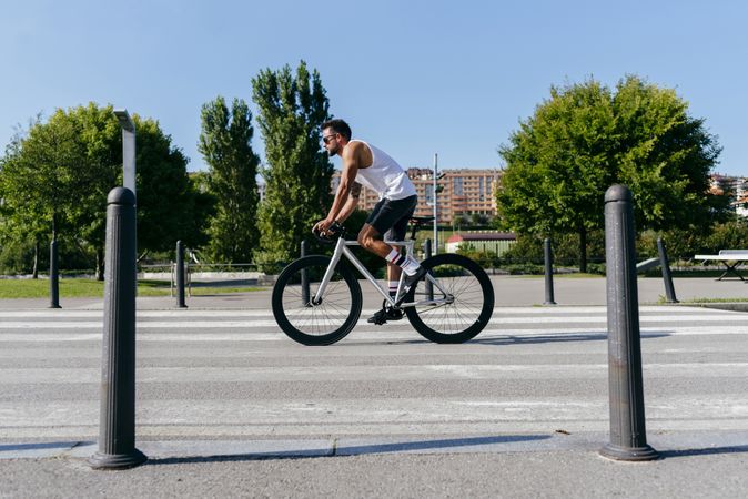Man riding bicycle on city roadway