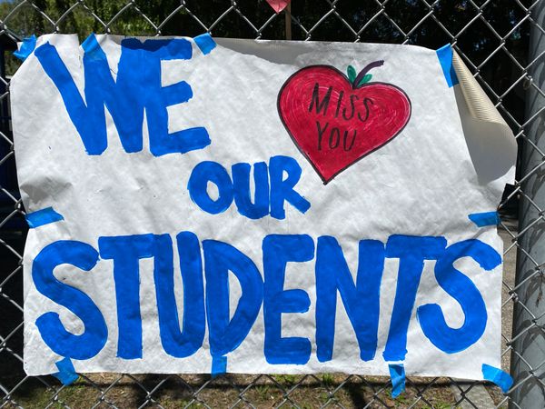 Close up shot of handmade sign  from a teacher missing their students during lockdown
