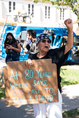Los Angeles, CA, USA — June 7th, 2020: older protestor holds sign and fist up at protest