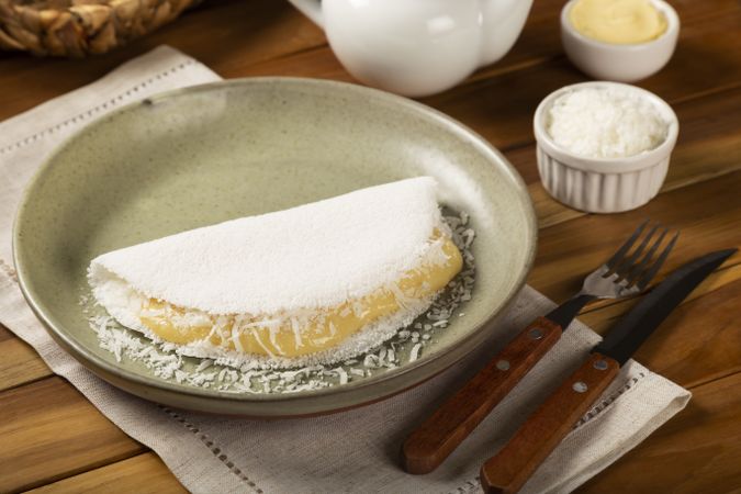 Sweet tapioca stuffed with coconut cream. Brazilian tapioca.