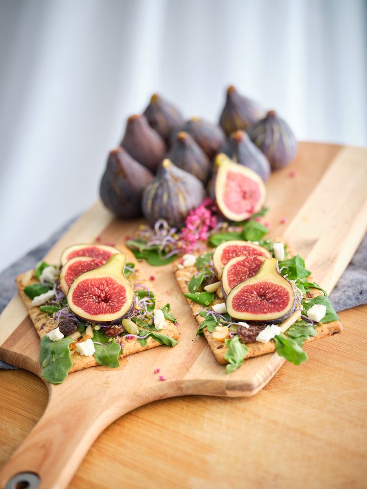 Arranged figs and served food placed on tray