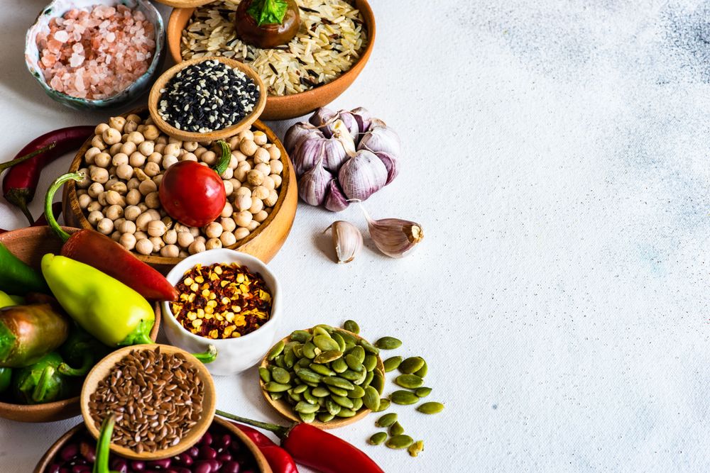Bowls of legumes and aromatics on kitchen counter