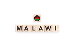 Wooden blocks bearing the name and flag of Malawi.