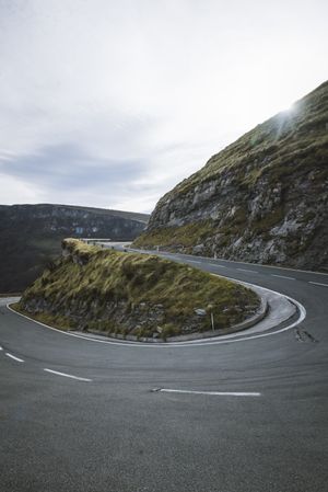 Road leaning between mountains
