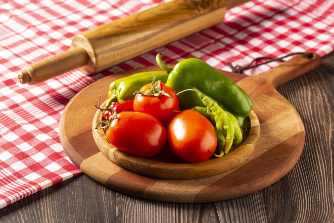 Wooden table with ingredients for pizza.