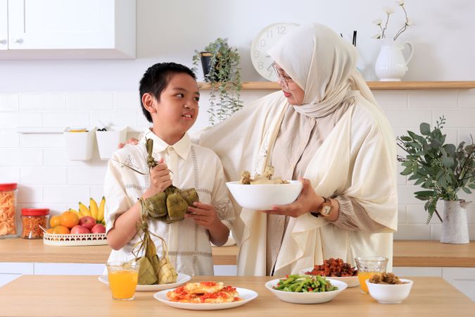 Muslim Mom Preparing Eid Al Mubarak Dinner with a Boy